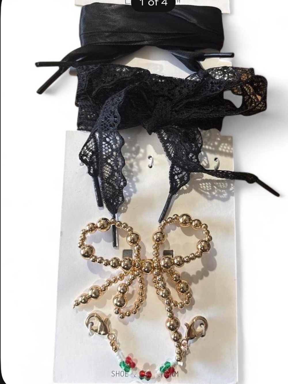 Leith black lace and satin shoe laces with gold bow